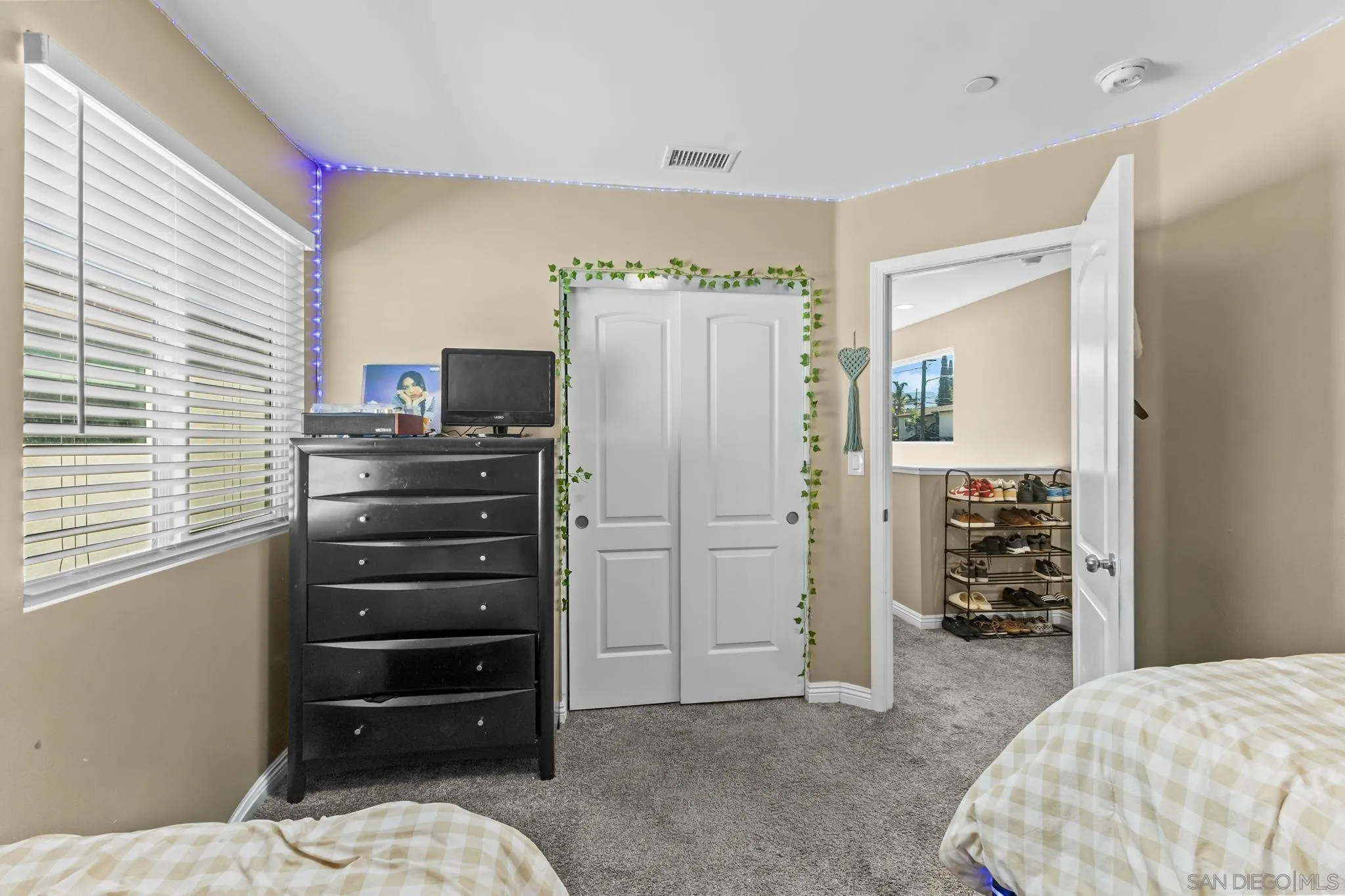 903 Concepcion Avenue Spring Valley, CA 91977 - Photo 33 of 69 a bedroom with a bed and a television