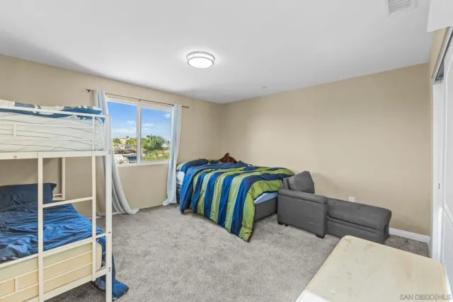 a bedroom with a bed and a closet