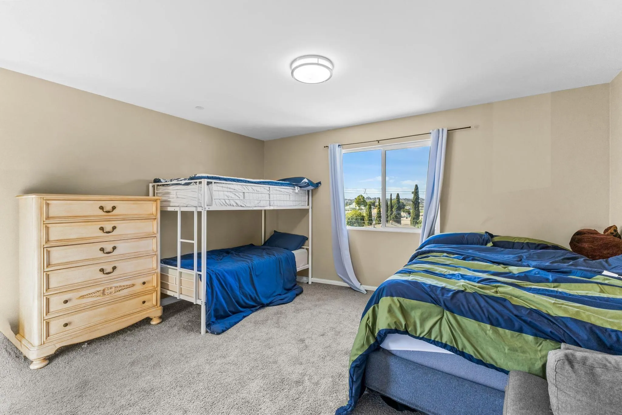 903 Concepcion Avenue Spring Valley, CA 91977 - Photo 35 of 69 a bedroom with a bed and a window