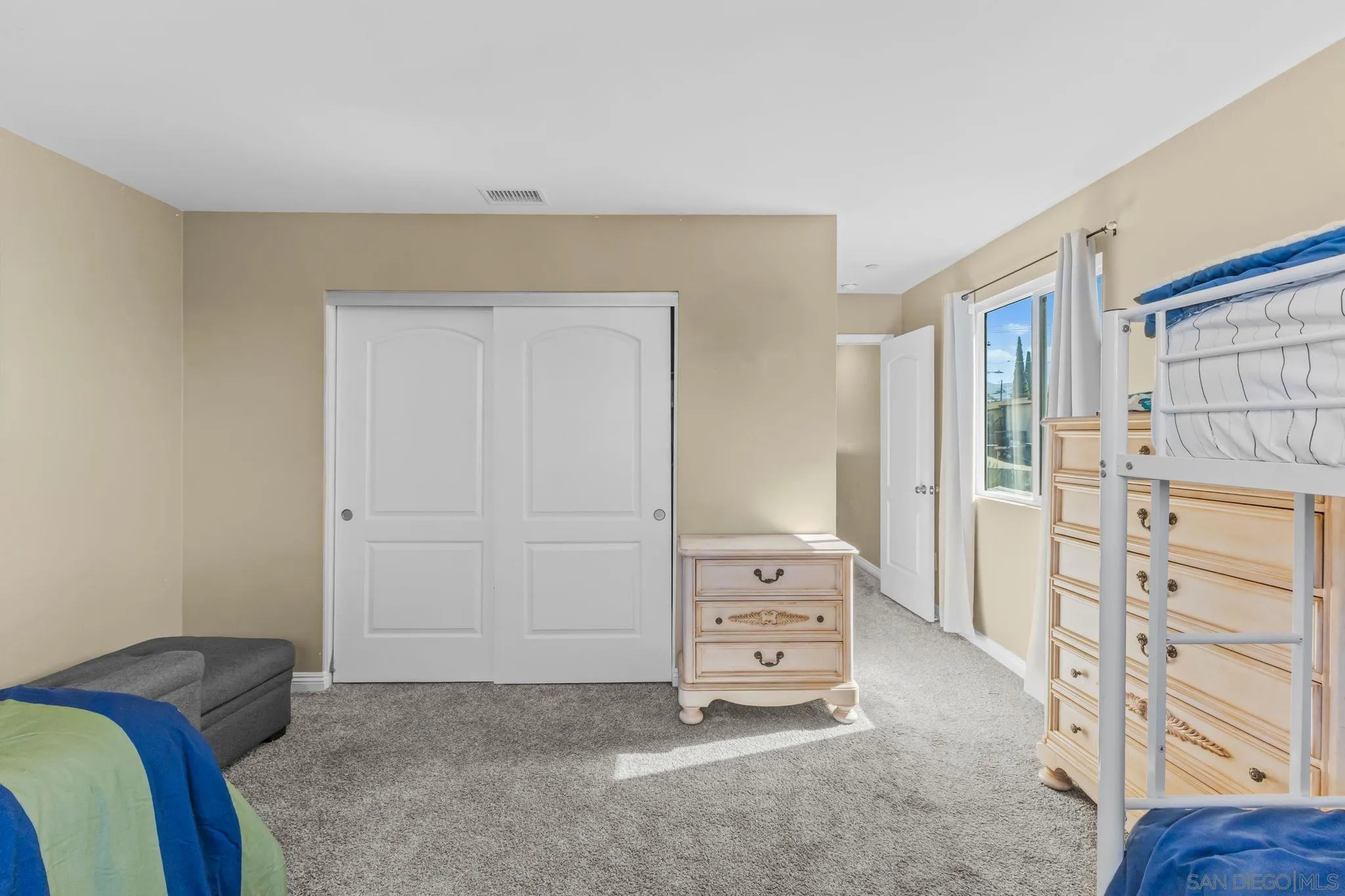 903 Concepcion Avenue Spring Valley, CA 91977 - Photo 36 of 69 a bedroom with a bed and a closet