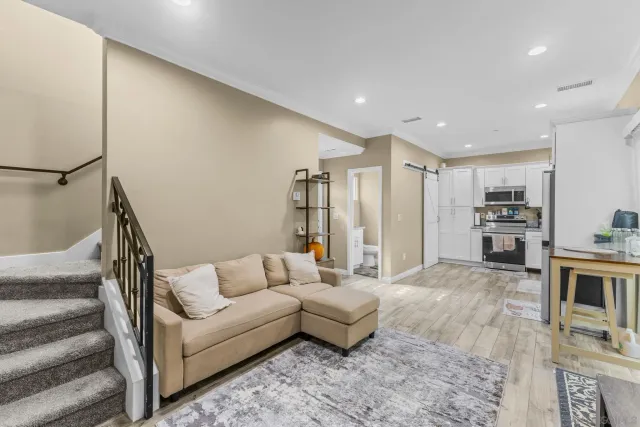 a bedroom with a bed and a flat tv screen on the table