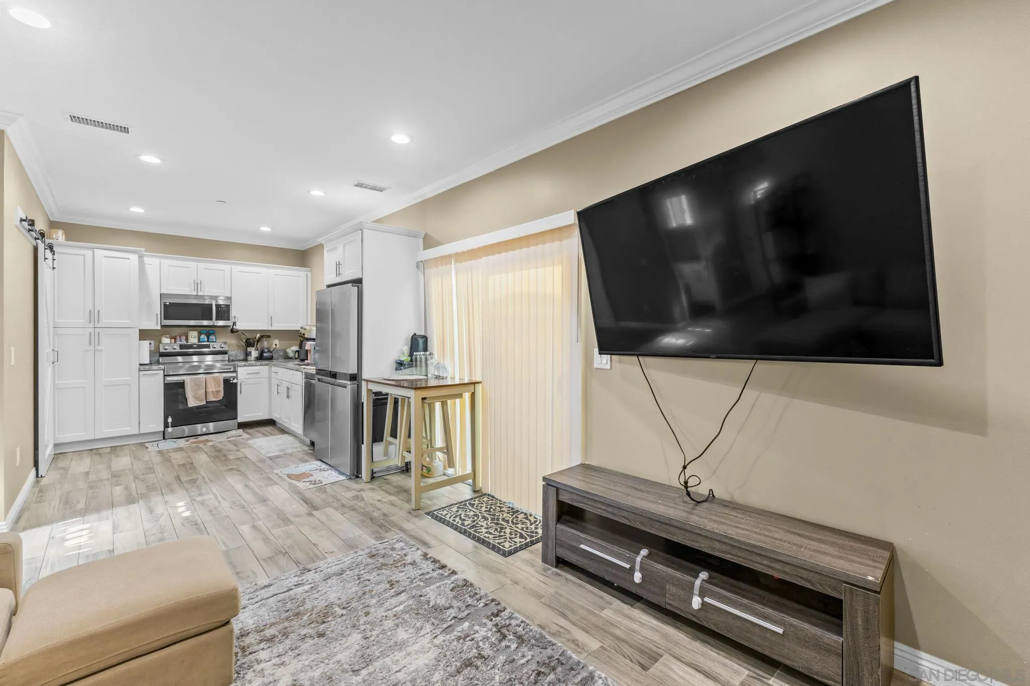 903 Concepcion Avenue Spring Valley, CA 91977 - Photo 54 of 69 a living room with stainless steel appliances furniture and a flat screen tv