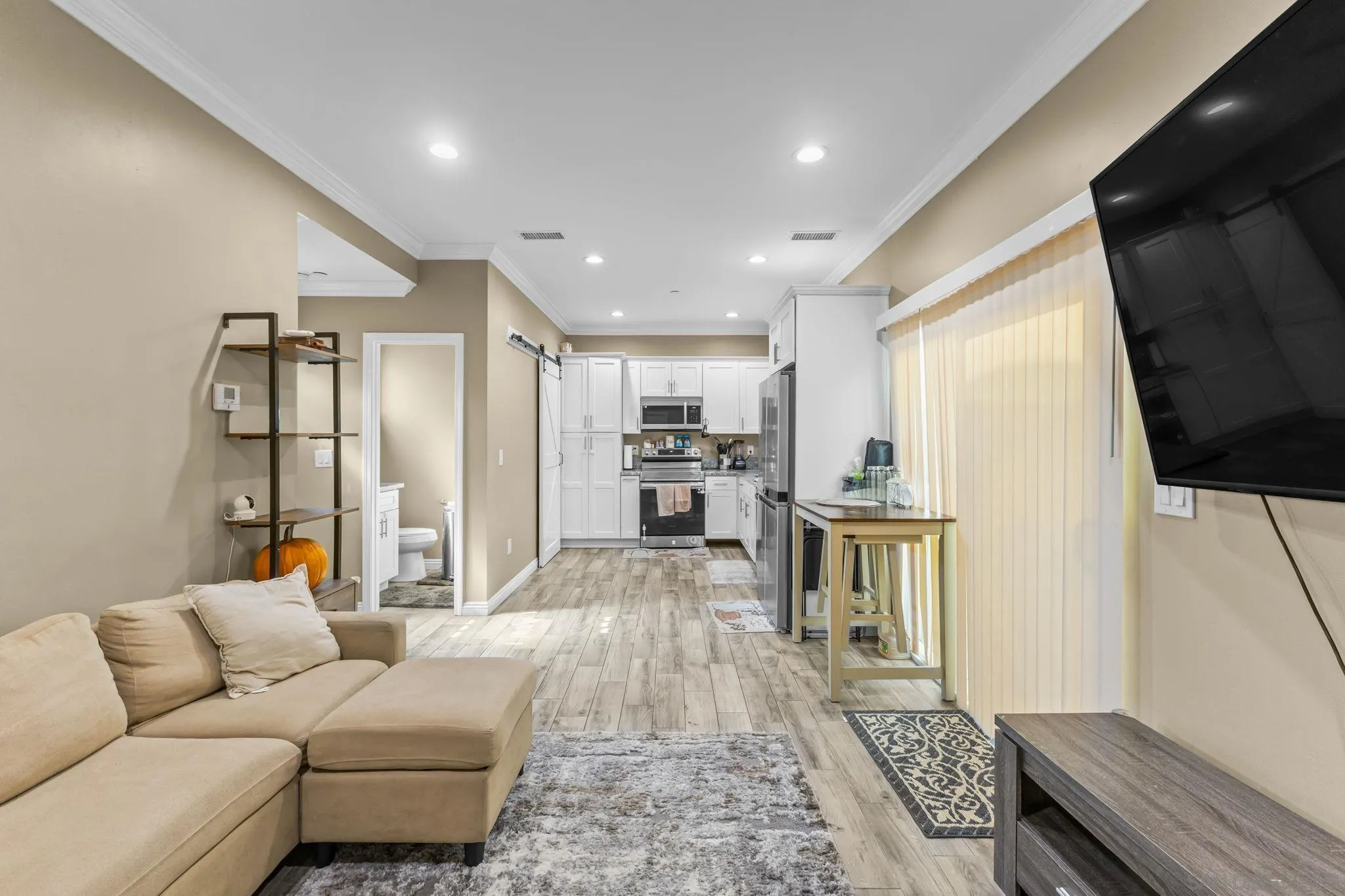 903 Concepcion Avenue Spring Valley, CA 91977 - Photo 55 of 69 a living room with furniture and a flat screen tv