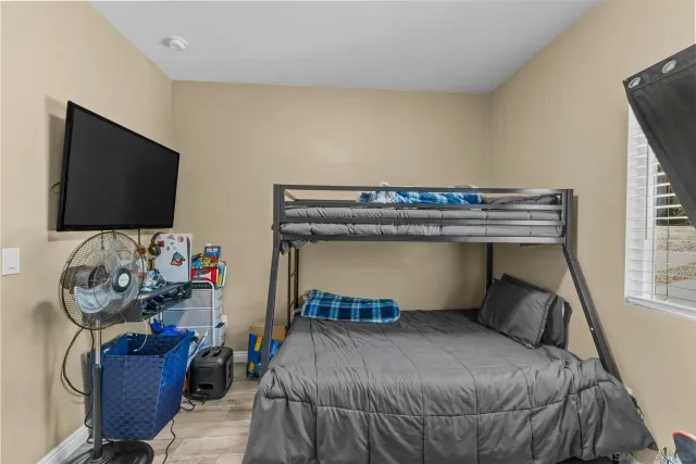 a bedroom with a workspace