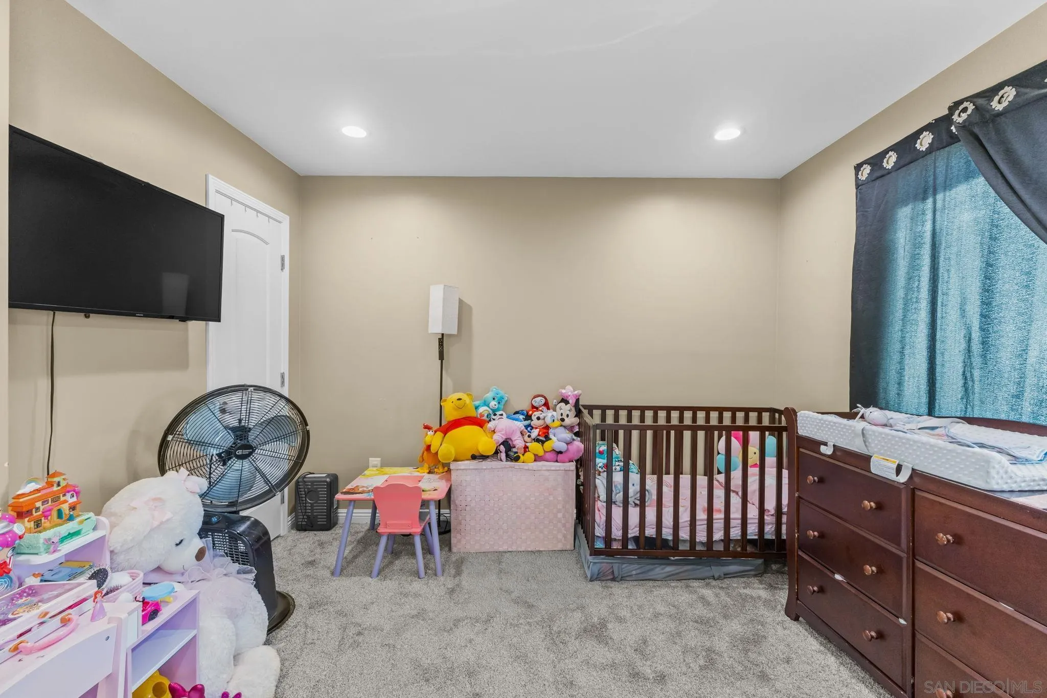 903 Concepcion Avenue Spring Valley, CA 91977 - Photo 61 of 69 a bedroom with furniture and a flat screen tv