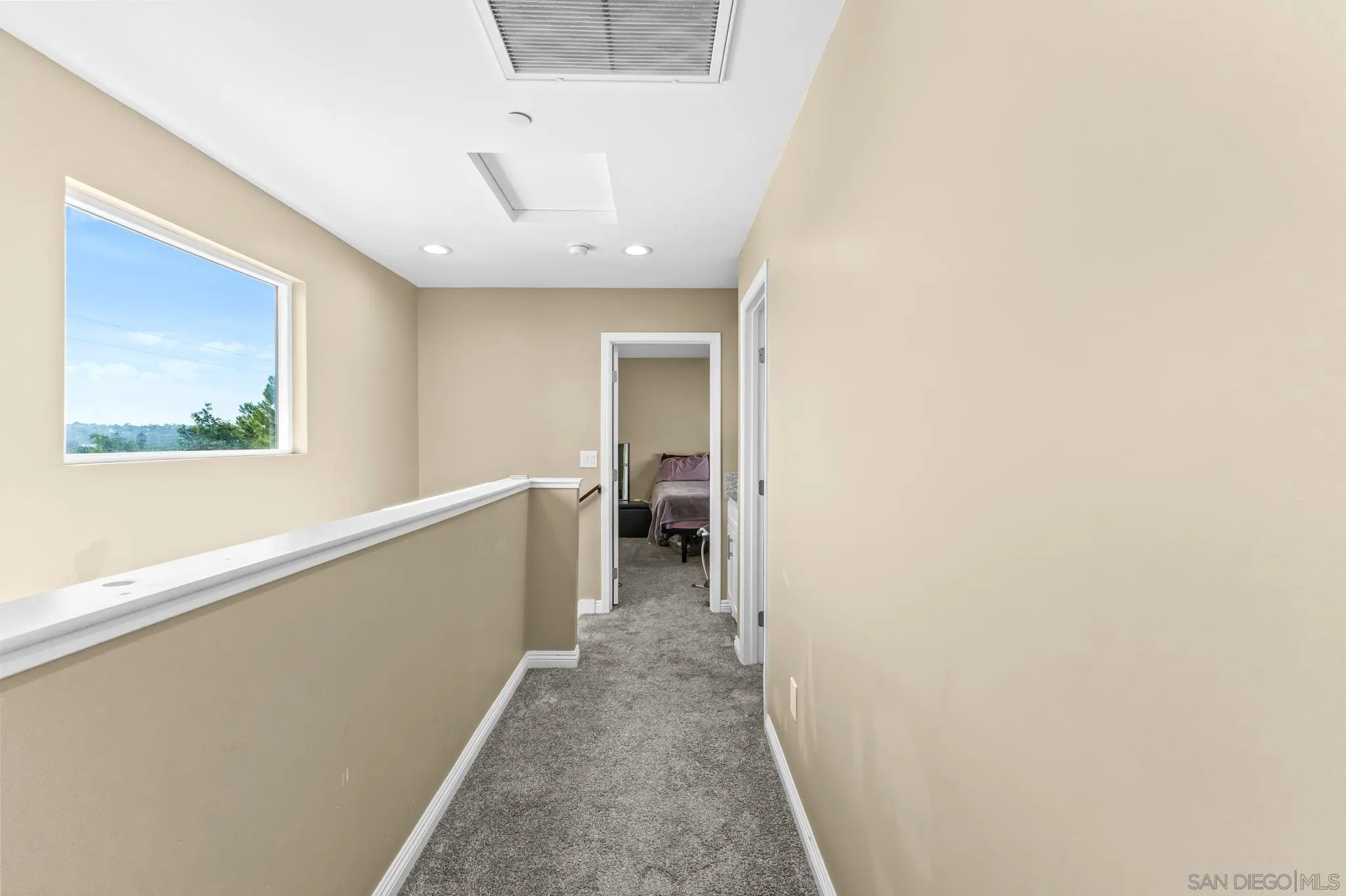 903 Concepcion Avenue Spring Valley, CA 91977 - Photo 66 of 69 a view of a hallway with wooden floor and a bathroom