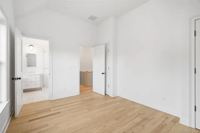 a bathroom with a shower sink and mirror