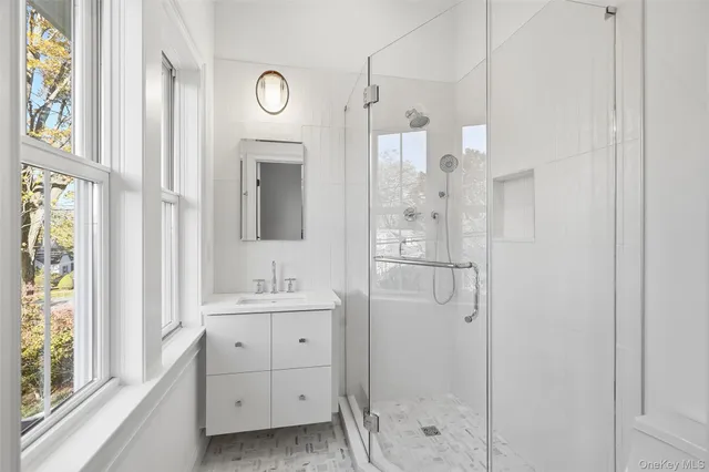 a living room with furniture a rug and a window