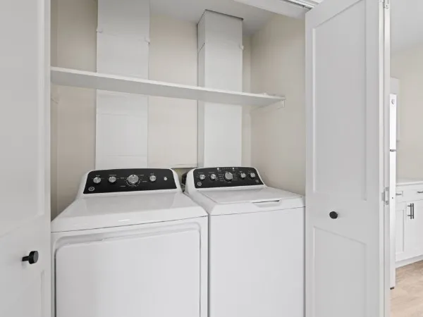a view of storage and utility room with washer and dryer