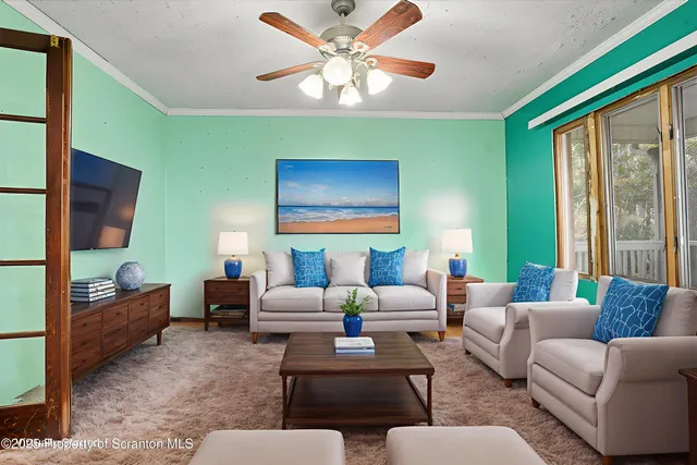 a view of a room with wooden floor and windows