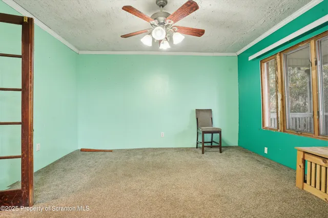 a room with window and pool table