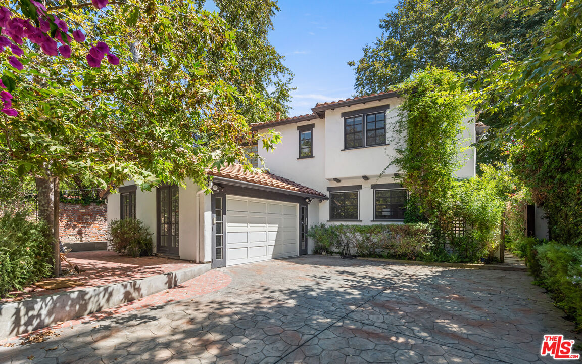 558 East Channel Road Santa Monica, CA 90402 - Photo 1 of 34 a front view of a house with a yard and garage