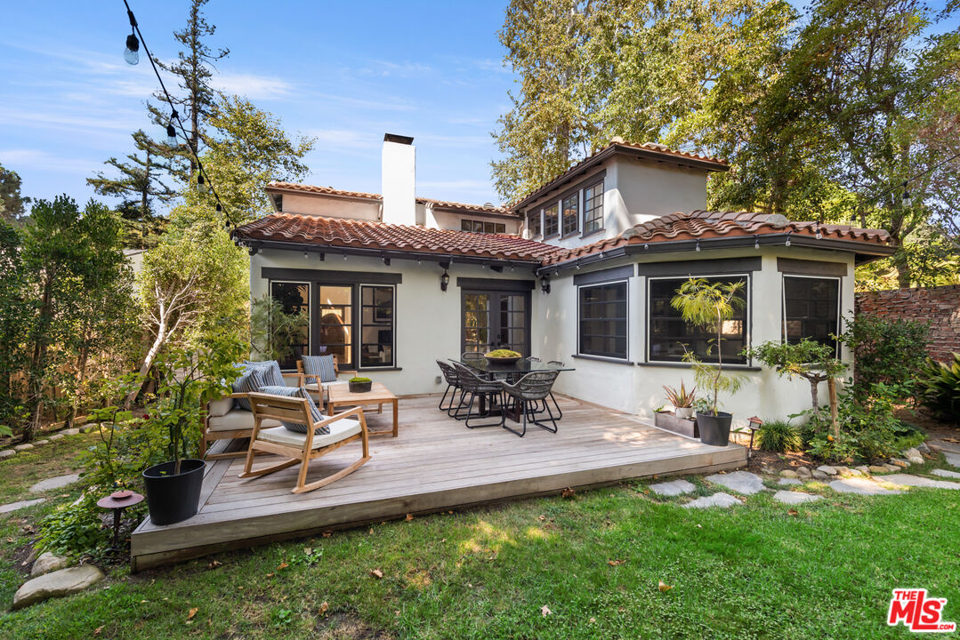 558 East Channel Road Santa Monica, CA 90402 - Photo 15 of 34 a view of a house with backyard and sitting area