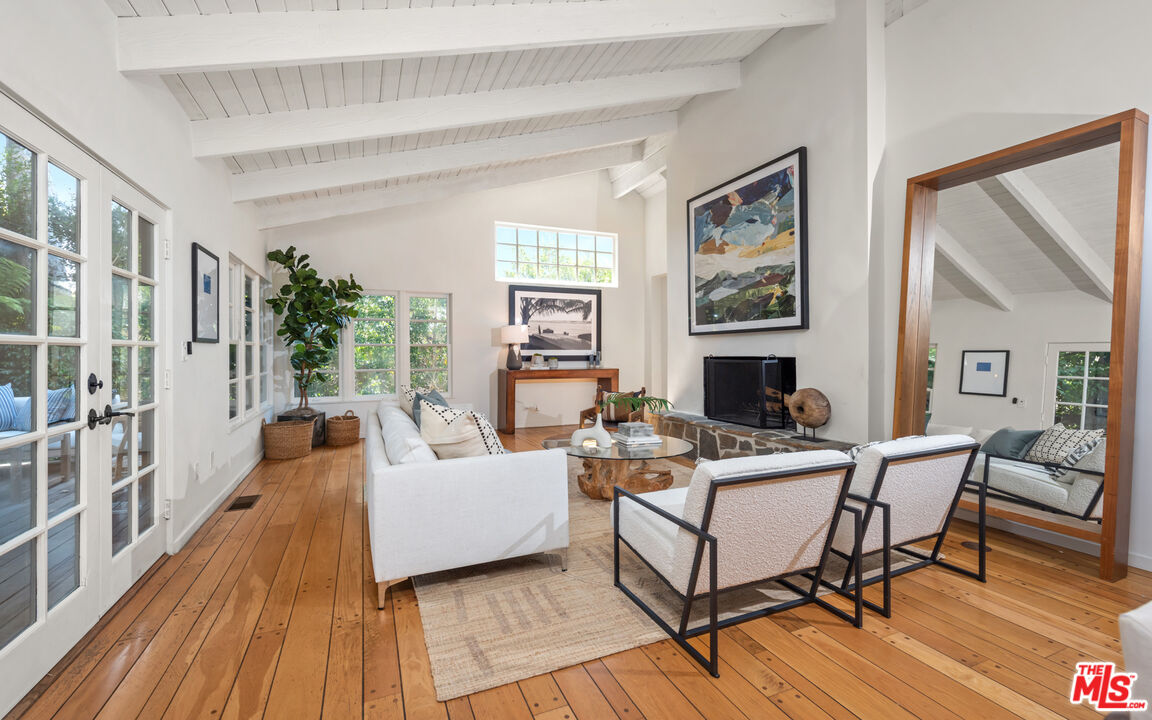 558 East Channel Road Santa Monica, CA 90402 - Photo 5 of 34 a living room with fireplace furniture and a wooden floor