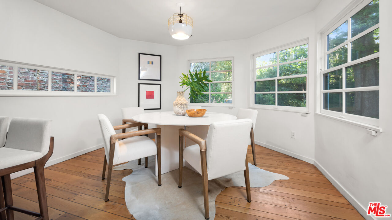 558 East Channel Road Santa Monica, CA 90402 - Photo 10 of 34 a workspace with furniture window and wooden floor