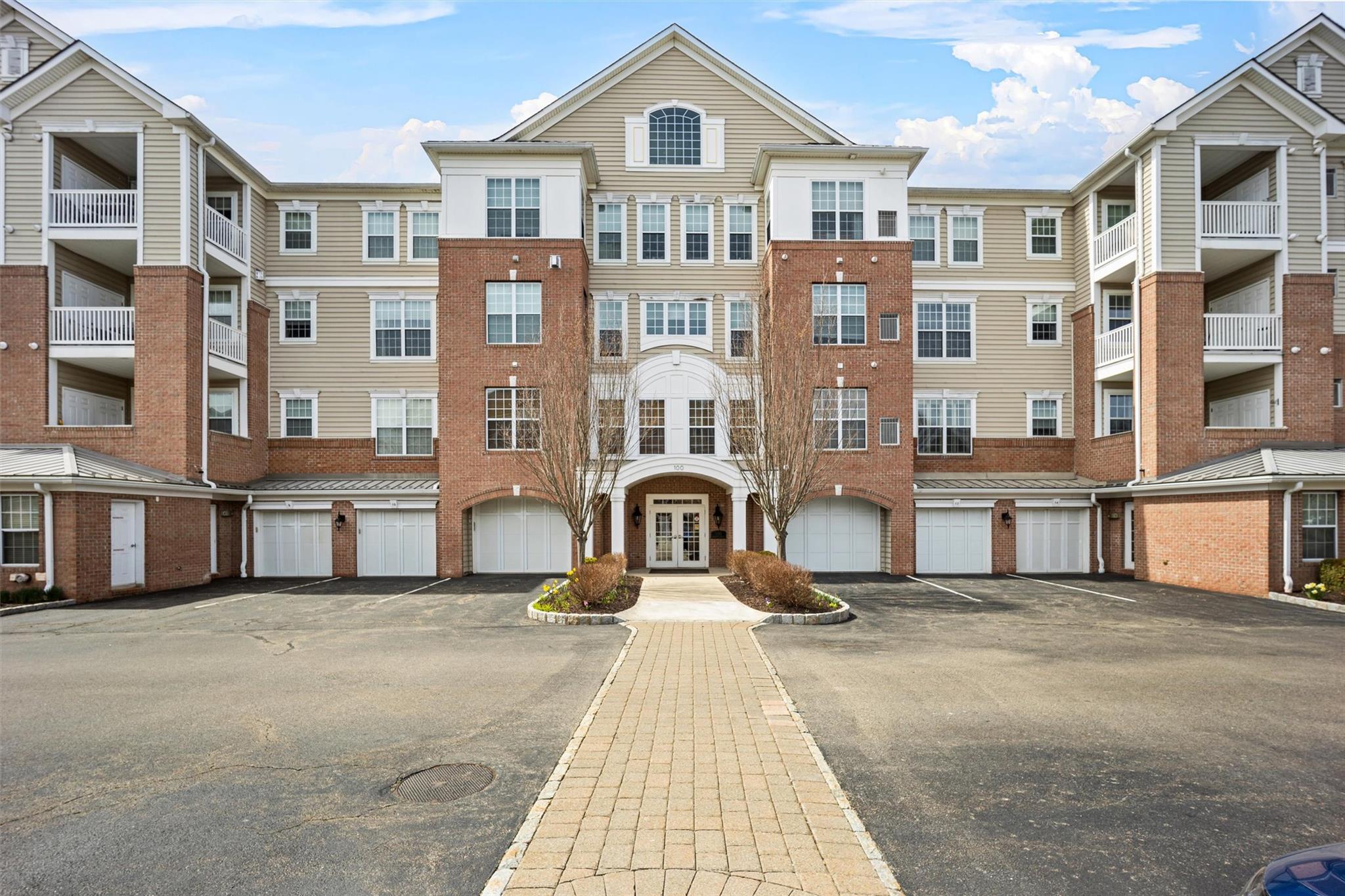 a front view of a building with many windows