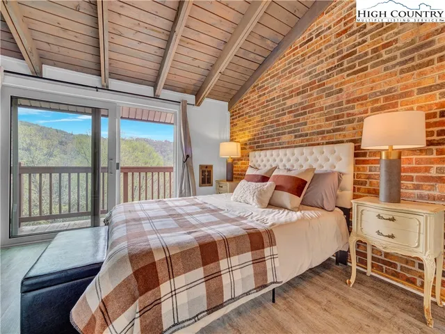 a view of a dinning table and chairs in patio of the house