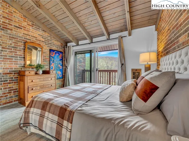a view of a house with backyard porch and sitting area