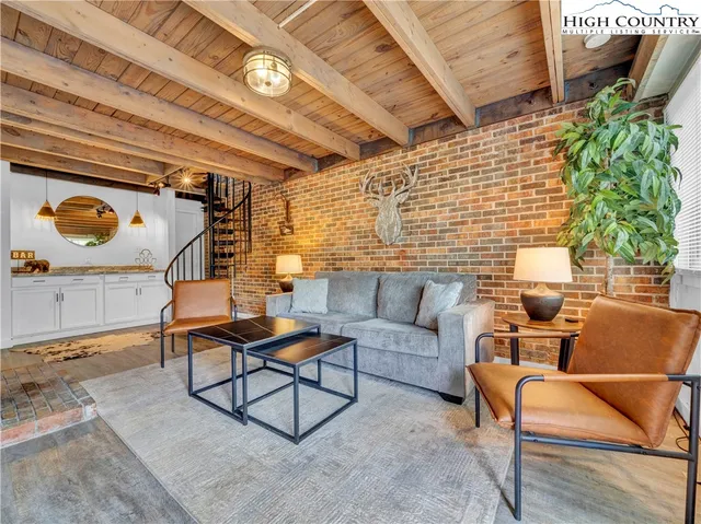 a bathroom with a toilet and a shower curtain