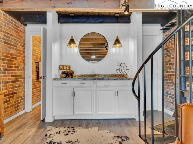 a kitchen with stainless steel appliances granite countertop a stove and cabinets