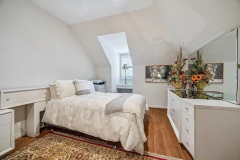 a bedroom with bed and window