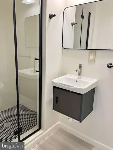 a bathroom with a sink and mirror
