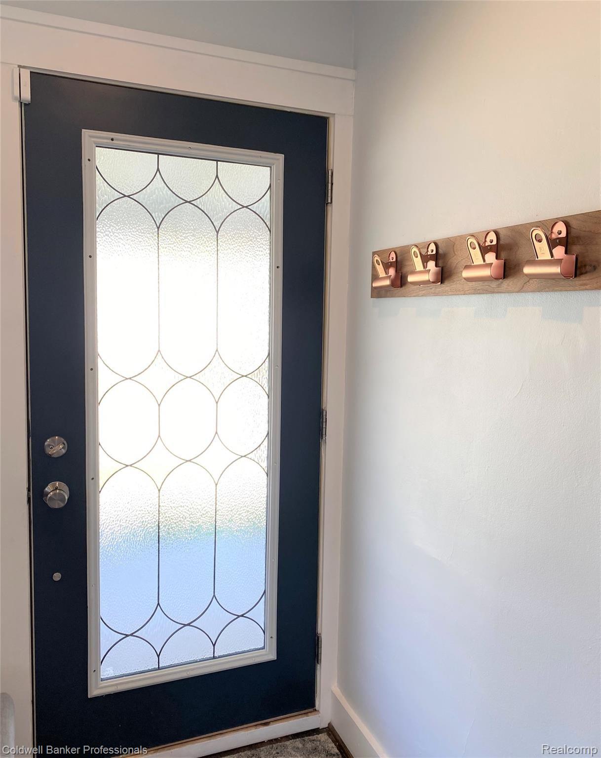 Front door offers privacy and lots of natural light