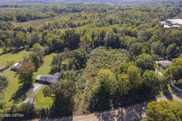 an aerial view of a town with trees
