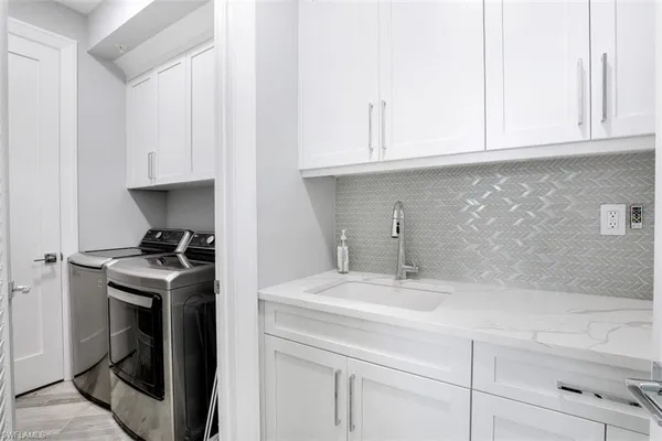 a kitchen with a sink and cabinets