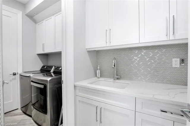 a kitchen with a sink and cabinets