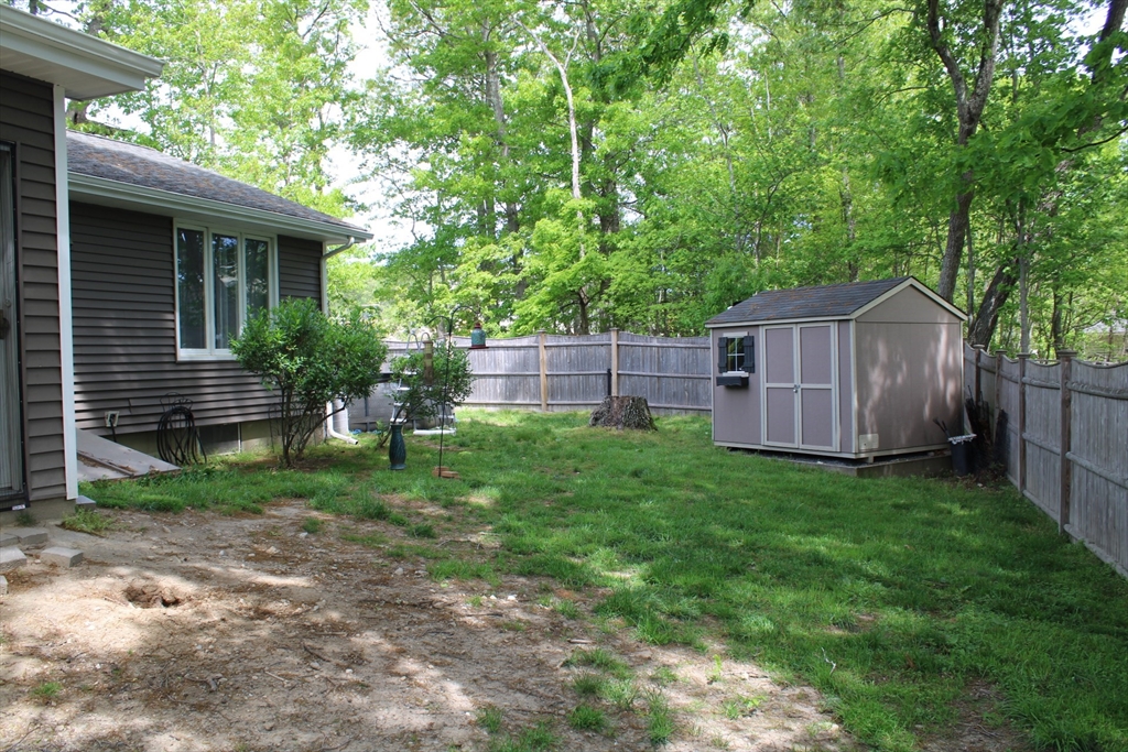 225 Braemoor Road Brockton, MA 02301 - Photo 8 of 29 a backyard of a house with lots of green space