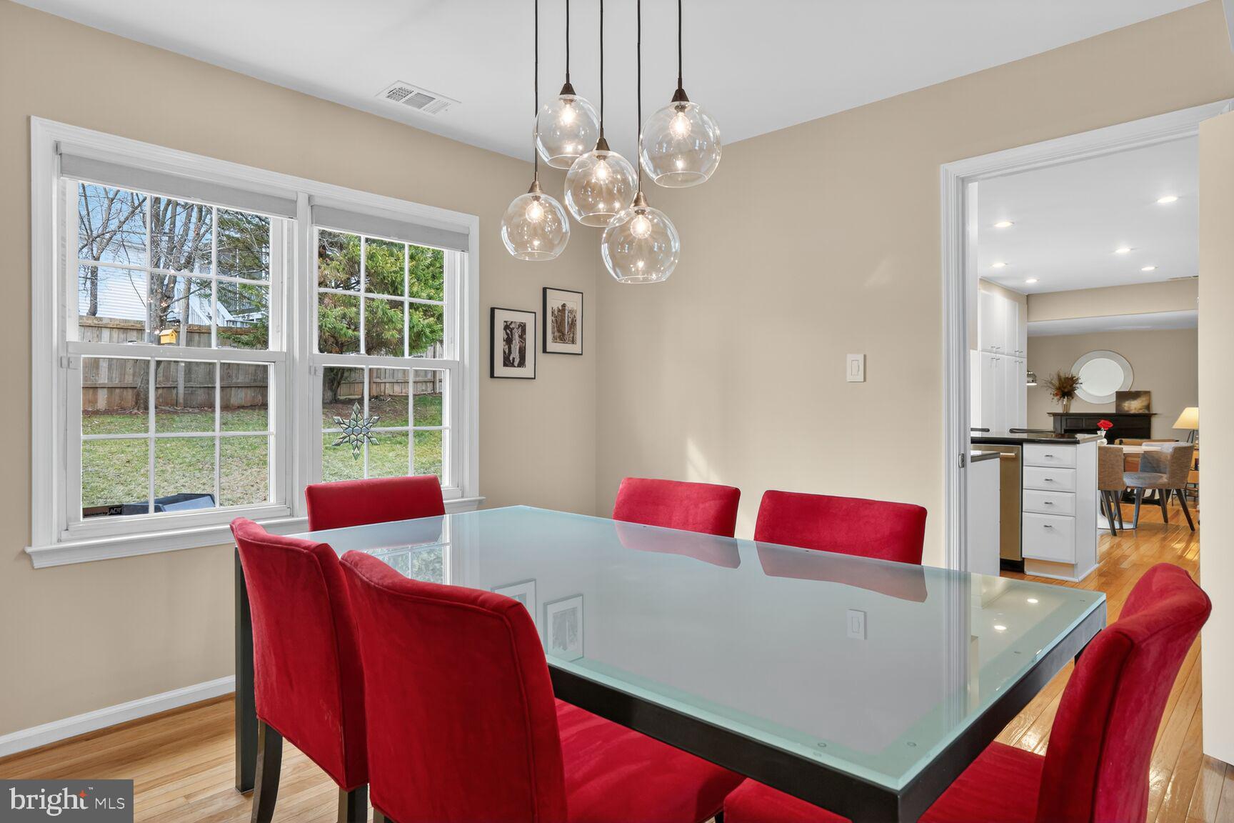 1354 Shallow Ford Road Herndon, VA 20170 - Photo 11 of 34 a view of a dining room with furniture and a chandelier