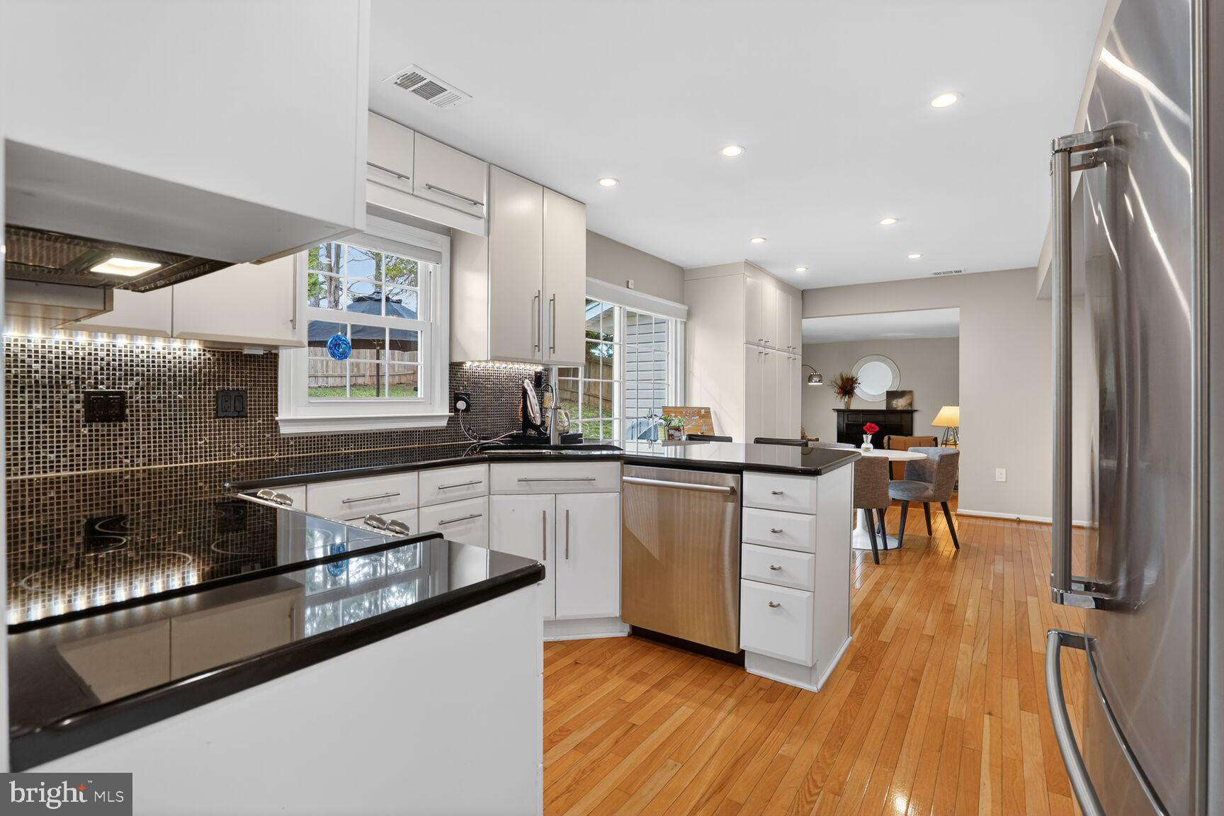 1354 Shallow Ford Road Herndon, VA 20170 - Photo 13 of 34 a kitchen with stainless steel appliances granite countertop sink stove top oven and cabinets