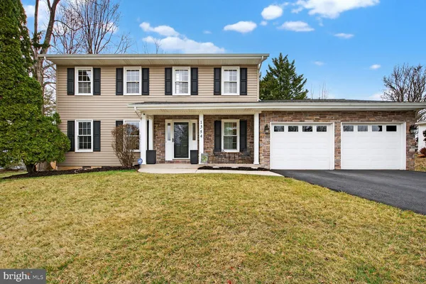 front view of a house with a swimming pool