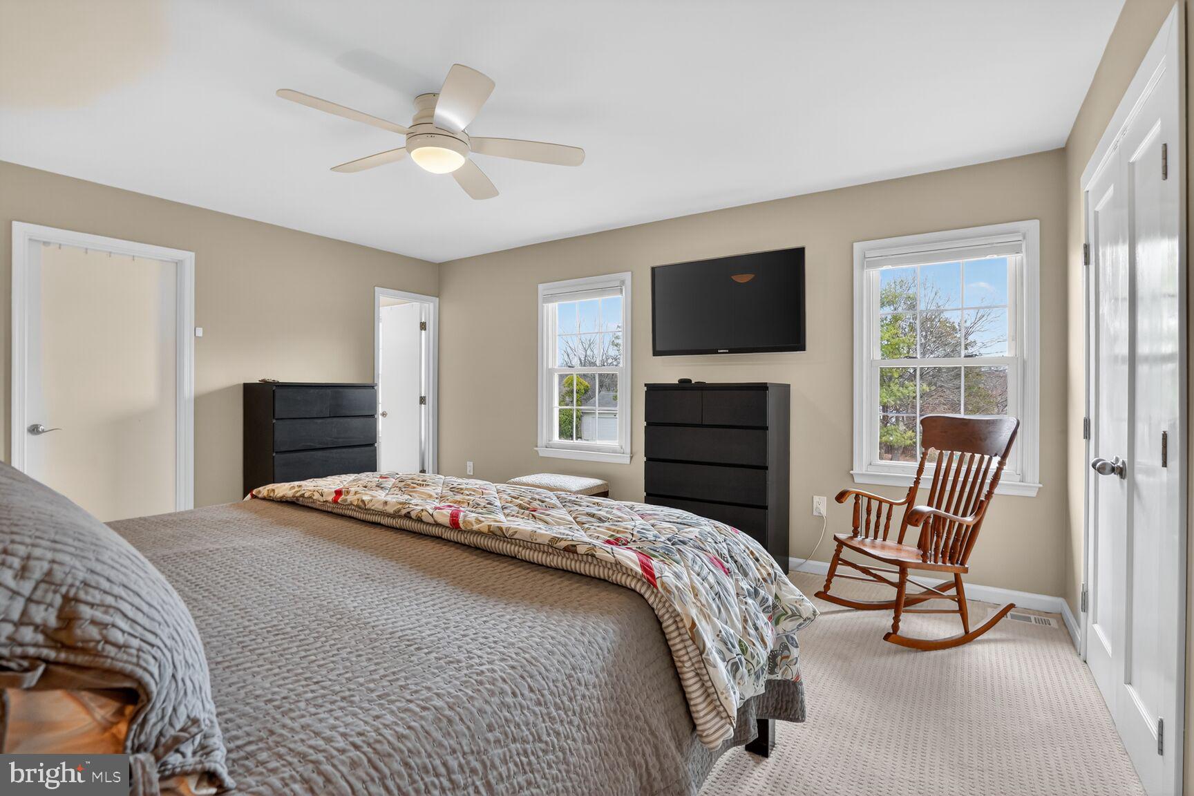 1354 Shallow Ford Road Herndon, VA 20170 - Photo 22 of 34 a bedroom with a bed and a flat screen tv