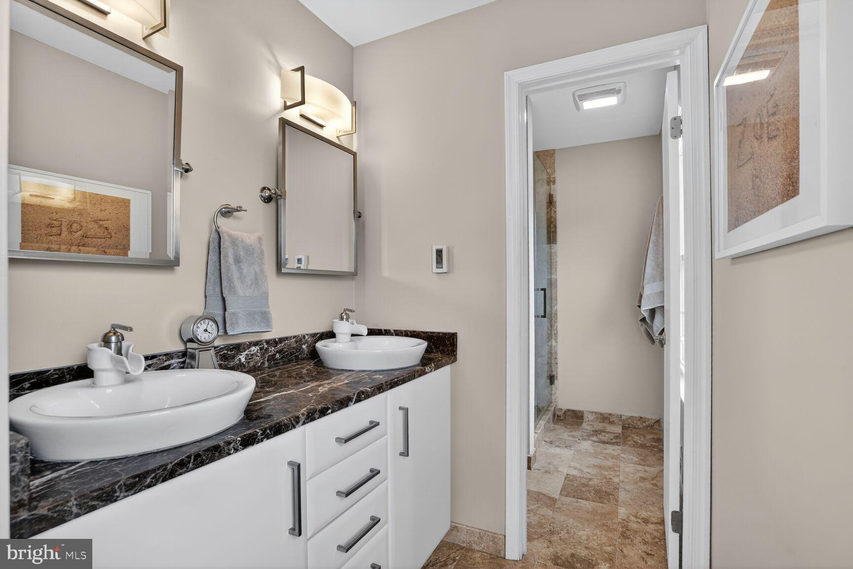 1354 Shallow Ford Road Herndon, VA 20170 - Photo 23 of 34 a bathroom with a sink and a mirror