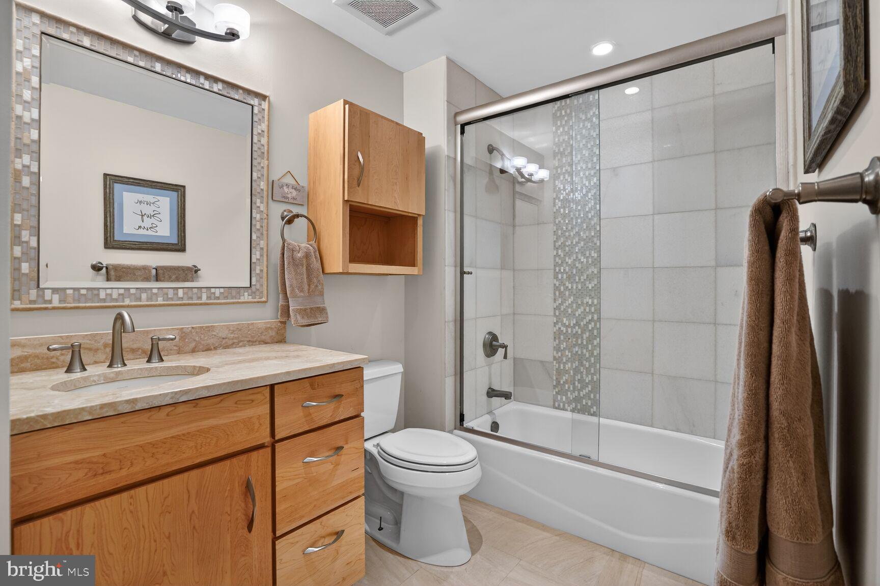 1354 Shallow Ford Road Herndon, VA 20170 - Photo 28 of 34 a bathroom with a granite countertop sink toilet and shower
