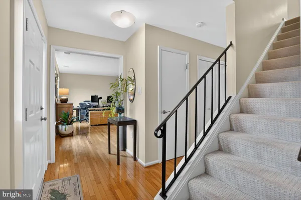 view of entryway and hall with wooden floor
