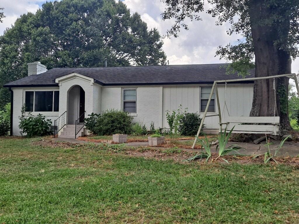 a house view with a garden space