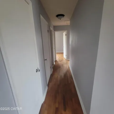 a view of a hallway with a glass door