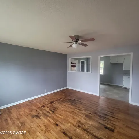 a view of an empty room with a window