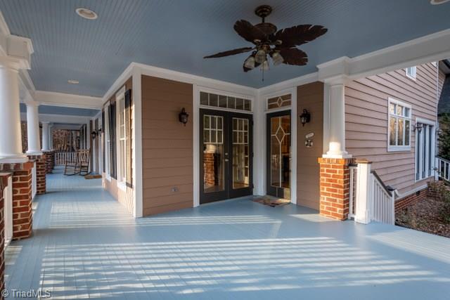 7381 Bullard Road Clemmons, NC 27012 - Photo 5 of 36 Wrap around porch with entry to kitchen & dining room