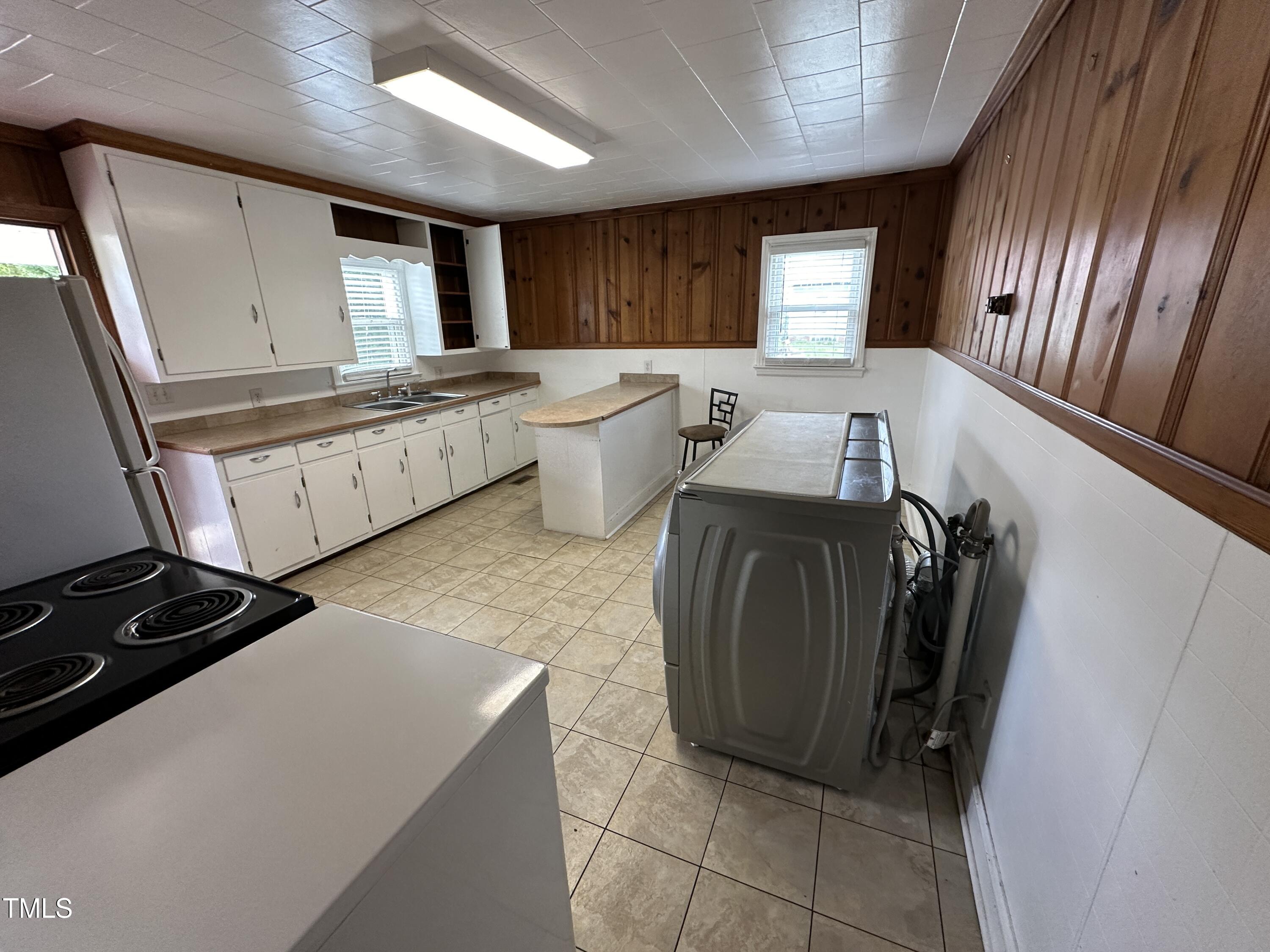4459 Highway 62 Burlington, NC 27215 - Photo 9 of 27 a kitchen with a refrigerator and window