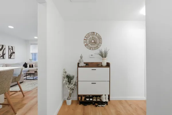 a room with furniture and wooden floor