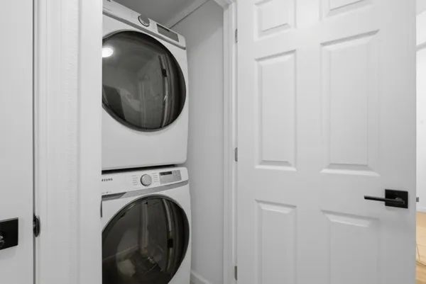 a view of a hallway with washer and dryer