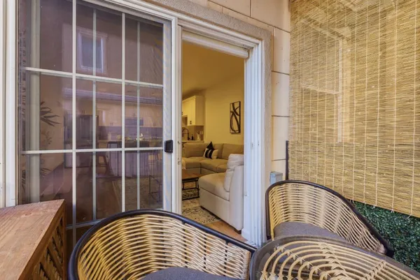 a view of balcony with furniture