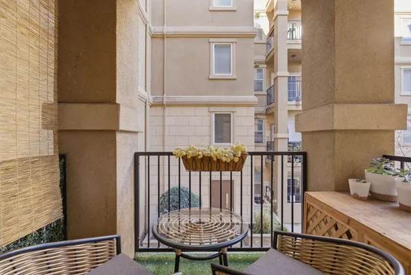a view of a chair and table on the deck