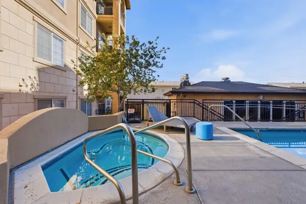 a view of a swimming pool with a lounge chair
