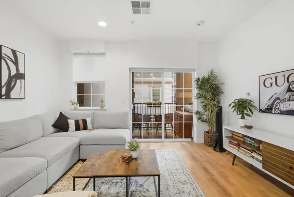 a living room with furniture and a table