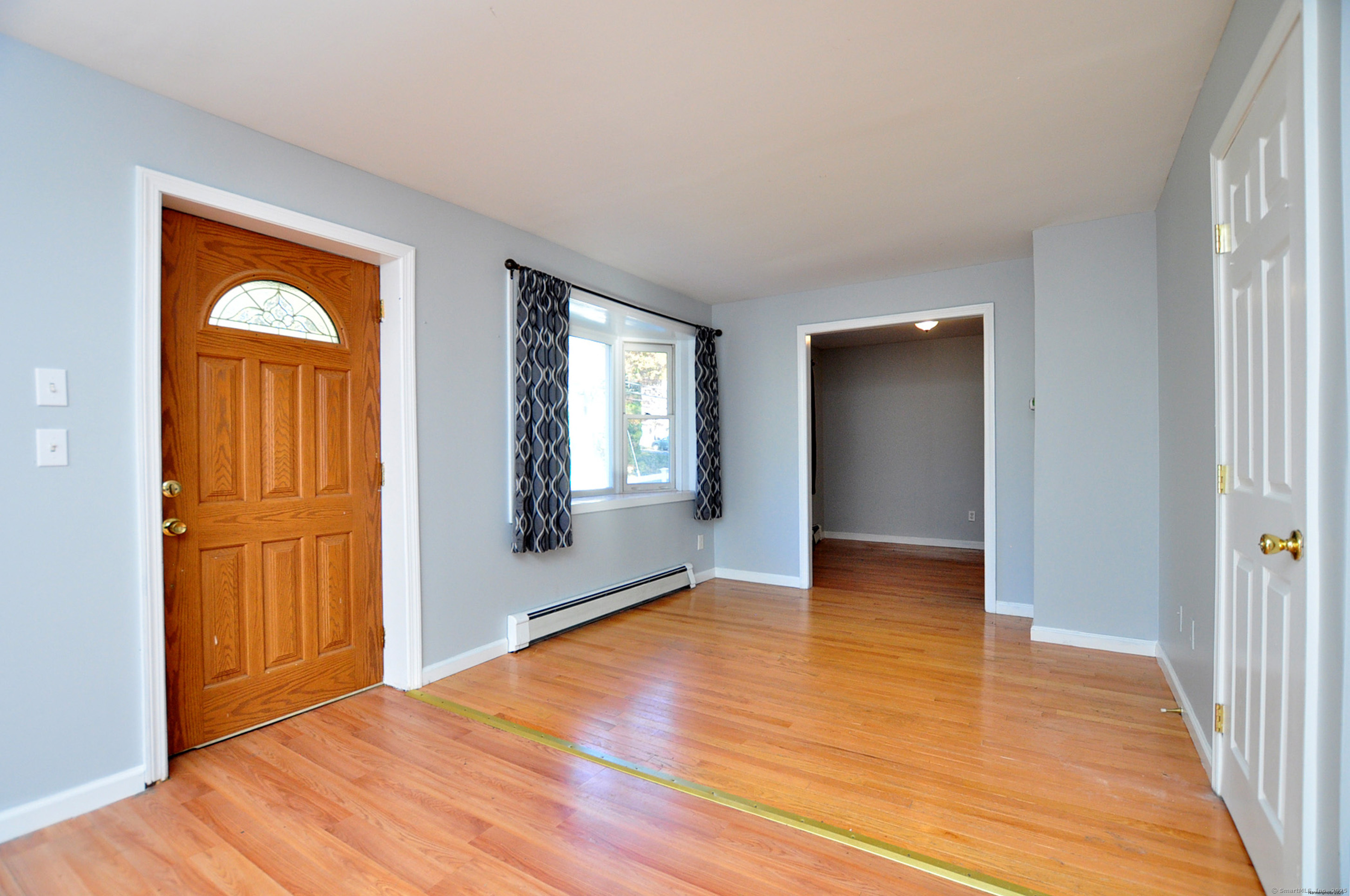 15 Clark Hill Road Prospect, CT 06712 - Photo 12 of 35 a view of empty room with wooden floor and fan